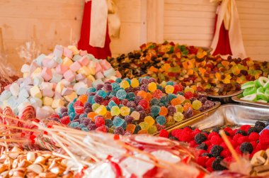 Sweet and sugar colorful candies in the shop for background.