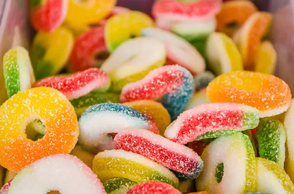 Sweet and colorful jellies candies in the shop for background.