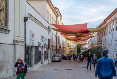 Crucified canvas above the promenade in the town of Pecs, Hungary