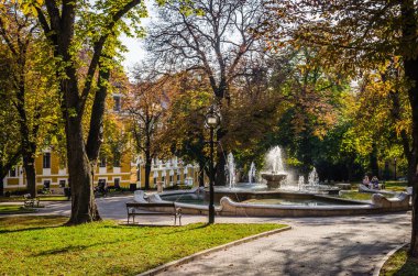 Pecs, Hungary - October 06, 2018: The fountain in the city park Pecs, Hungary, in the fall.