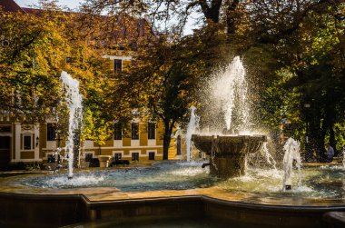 Pecs, Hungary - October 06, 2018: The fountain in the city park Pecs, Hungary, in the fall.