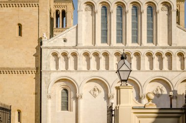 Pecs, Hungary - October 06, 2018: Statues in the courtyard on the wall of the Basilica of St. Peter & st. Paul's Cathedral in Pecs, Hungary.