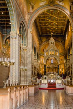 Pecs, Hungary - October 06, 2018: Statues in the courtyard on the wall of the Basilica of St. Peter & st. Paul's Cathedral in Pecs, Hungary.