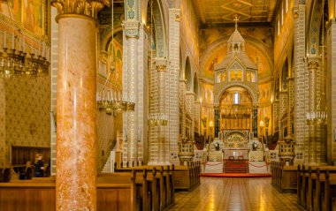 Pecs, Hungary - October 06, 2018: Statues in the courtyard on the wall of the Basilica of St. Peter & st. Paul's Cathedral in Pecs, Hungary.