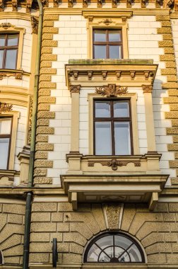 Pecs, Hungary - October 06, 2018: Windows with decorative baroque facades in the center of Pecs, Hungary