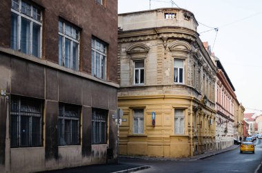 Pecs, Hungary - October 06, 2018: Windows with decorative baroque facades in the center of Pecs, Hungary