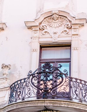 Pecs, Hungary - October 06, 2018: Windows with decorative baroque facades in the center of Pecs, Hungary