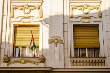 Pecs, Hungary - October 06, 2018: Windows with decorative baroque facades in the center of Pecs, Hungary