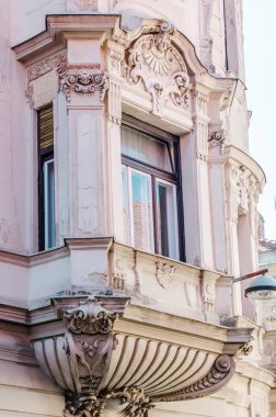 Pecs, Hungary - October 06, 2018: Windows with decorative baroque facades in the center of Pecs, Hungary