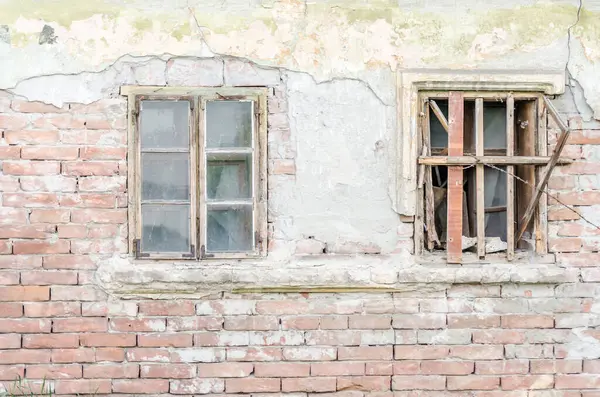 stock image Old dilapidated house in the suburbs of Petrovaradin fortress. Shattered windows on an old house in the suburbs of the Petrovaradin fortress.