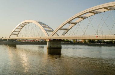 Novi Sad, Serbia. July - 25. 2022. Zezelj bridge on river Danube in Novi Sad from the Petrovaradin side. View of the Zezelje Bridge on the Danube in Novi Sad from the Petrovaradin side in the summer and in the afternoon.