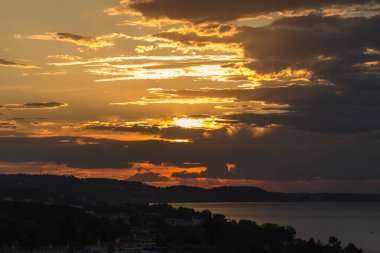 Sunrise over the small tourist town of Pefkochori, Greece in the early morning hours.