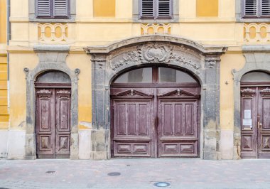Pecs, Hungary - October 06, 2018: wooden gate with decorative facade
