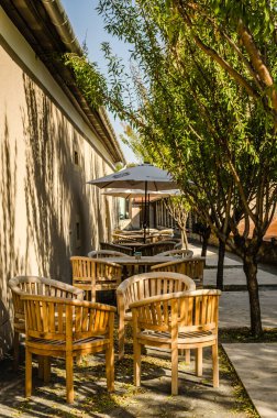 Pecs, Hungary - October 06, 2018: Wooden chairs in the restaurant in Pecs, Hungary.