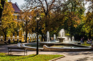 Pecs, Hungary - October 06, 2018: The fountain in the city park Pecs, Hungary, in the fall.