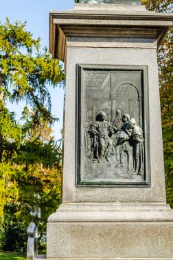 Pecs, Hungary - October 06, 2018: Statue of Ignac Szepesy and basilica of St. Peter, St. Paul, Pecs cathedral in Hungary the sign on the statue says Ignac Szepesy bishop.