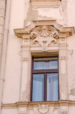 Pecs, Hungary - October 06, 2018: Windows with decorative baroque facades in the center of Pecs, Hungary