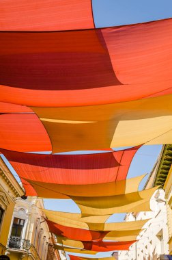 Crucified canvas above the promenade in the town of Pecs, Hungary