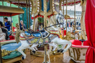 Novi Sad, Serbia - December 13. 2019: Downtown Novi Sad. The decorations on the children's carousel with wooden horses