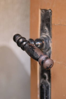 Metal decorative handles. Metal decorative handle on old massive entrance doors.
