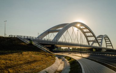 Novi Sad, Serbia. July - 25. 2022. Zezelj bridge on river Danube in Novi Sad from the Petrovaradin side. View of the Zezelje Bridge on the Danube in Novi Sad from the Petrovaradin side in the summer and in the afternoon.