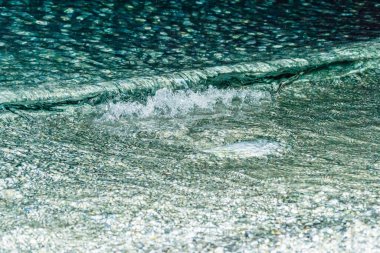 Sea water on the beach at night, Leptokarya, Greece. clipart