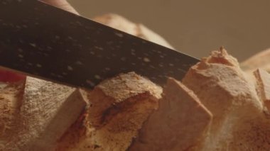 a hand raises a cape with fresh bread under it. traditional recipe with gluten. 4k footage