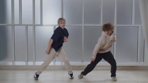 Energetic Boys Performing Contemporary Dance Together Studio Footage Twin Brothers — Stockvideo