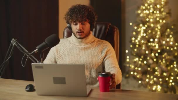 Vlogger Doing Christmas Podcast Indoor Footage Smiling Man Drinking Coffee — Videoclip de stoc