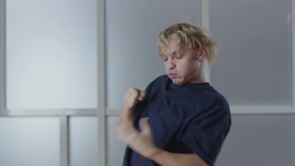 Blonde Young Man Dancing His Hands Energetic Guy Shirt Gesturing — Stockvideo