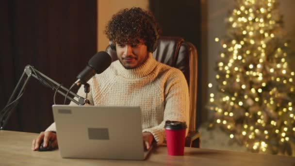 Cheerful Blogger Headphones Doing Christmas Podcast Smiling Streamer Using Laptop — Stock Video