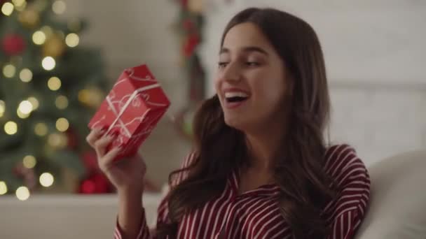 Smiling Woman Rejoices Received Christmas Gift Happy Girl Striped Pajamas — Video Stock