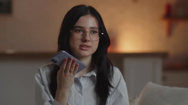 Young Brunette Woman Glasses Recording Audio Message Woman Uses Smartphone — Vídeos de Stock