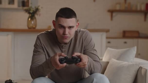 Close Young Man Focused Playing Game Console Man Screams Joy — Stock video
