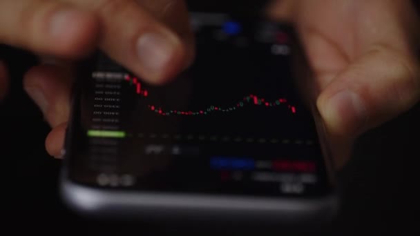 Experienced Trader Looks Stock Prices Companies Man Uses His Phone — Stock Video