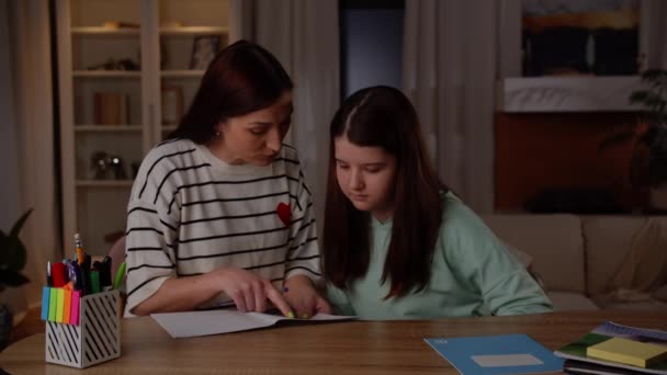 Woman Sits Table Checks Her Daughters Notebook Homework Caring Mother — Stock Video