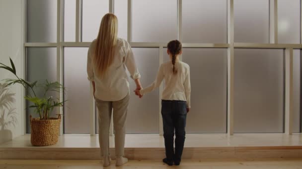 Back View Blond Young Mom Little Daughter Looking Panoramic Window — Stock Video