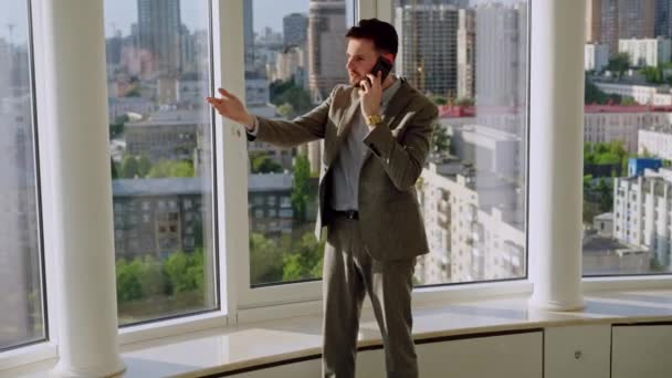 Successful Young Businessman Nice Suit Office Window Picks Phone Calls — Vídeos de Stock
