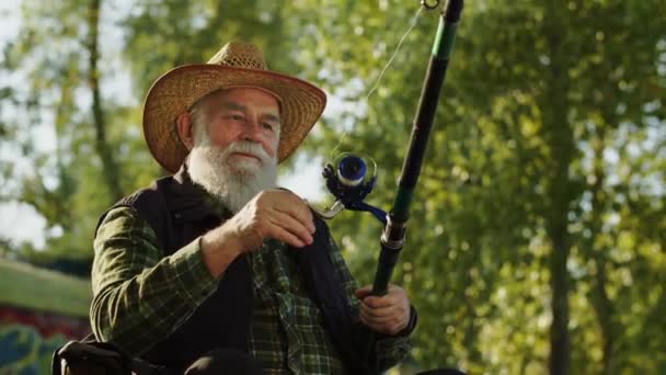 Old Man Fishing Gray Bearded Pensioner Fisherman Spinning Reel Fish — Stock Video