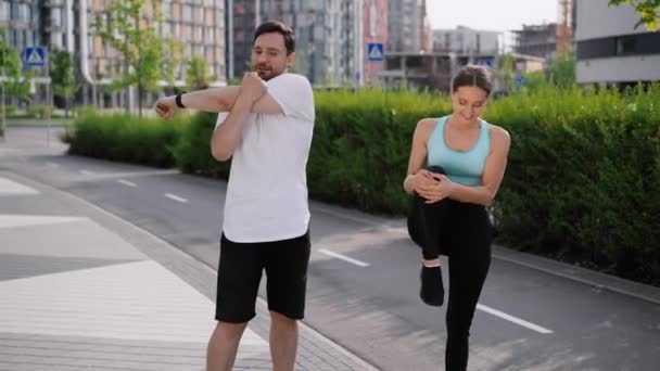 Young Positive Sportive Couple Does Morning Exercises Workout City Park — Stock Video