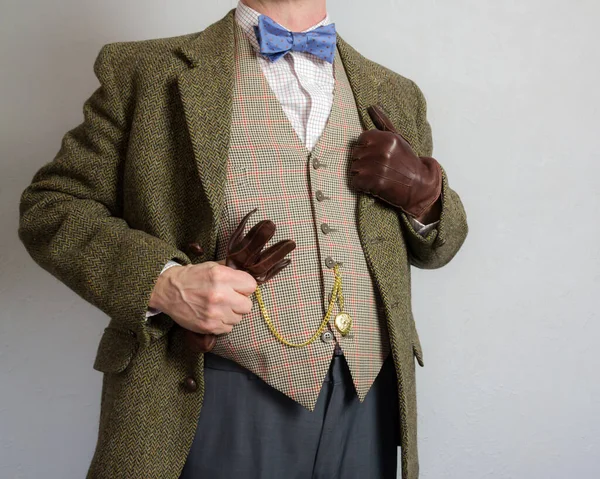 Portrait of Man in Tweed Suit and Leather Gloves. Vintage Style and Retro Fashion of Classic British Gentleman.
