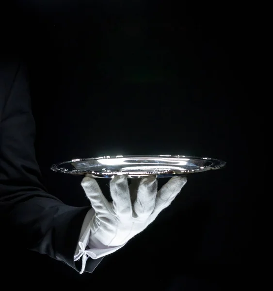 Isolated Image of White Glove Hand Holding Silver Serving Tray. Copy Space for Service Industry and Professional Hospitality.