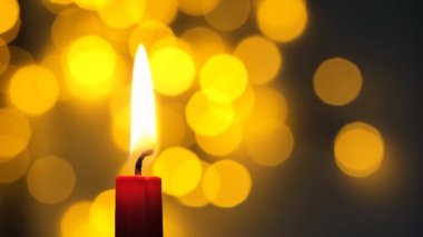 candle in a row on an abstract background. bokeh effect