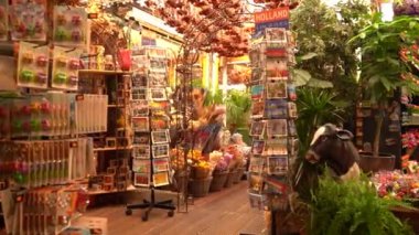 Amsterdam, Netherlands- 08.23.2022: souvenir shop. Magnets, plants, hemp. Tourist shop. Traditional Dutch stuff. Gift store in popular tourist area in Amsterdam. Traditional souvenirs from Netherlands