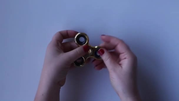 Womens Hands Light Background Rotate Golden Spinner Close Top View — Stock Video
