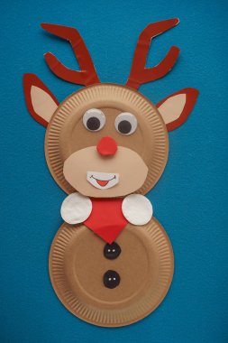 Christmas New Year Santa's deer handmade. Step by step photo instruction. DIY concept. Step 11-13. Cut out red triangle, glue it to the neck, glue cotton pads there, scarf is ready. Top view