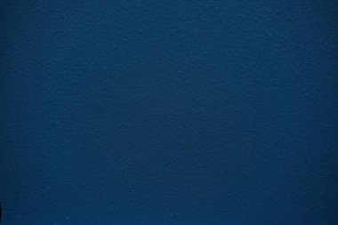 Dark blue corduroy background. High-resolution dark blue fabric texture that can be used as a pattern and tiled seamlessly. Blue Ribbed Corduroy Texture Background.