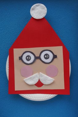 Christmas New Year Santa card handmade. Step by step photo instruction. DIY concept. Cut the cotton pad in half and glue Santa's mustache over her mouth. Step 11-14. Top view, Flat lay