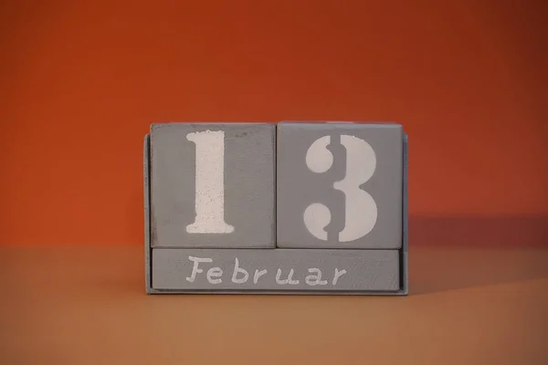 stock image 13 Februar on wooden grey cubes. Calendar cube date 13 February. Concept of date. Copy space for text or event. Educational cubes. Cube shape calendar for February 13 with empty space. Selective focus