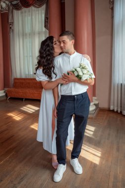 the groom and the bride in a white long dress . wedding day . High quality photo